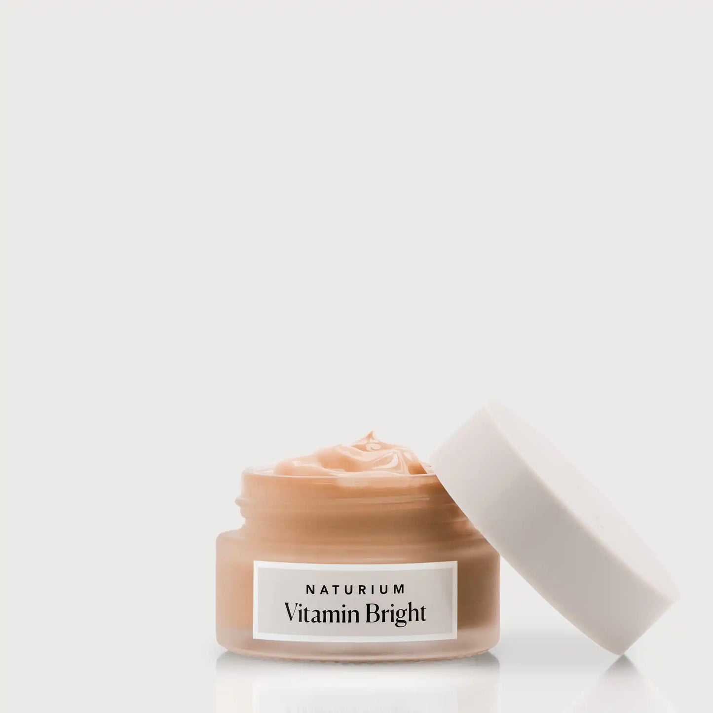 vitamin-bright-illuminating-eye-cream-w7 NATR-VitaminBright_DEEP_Primary_front_openjar_bone.webp